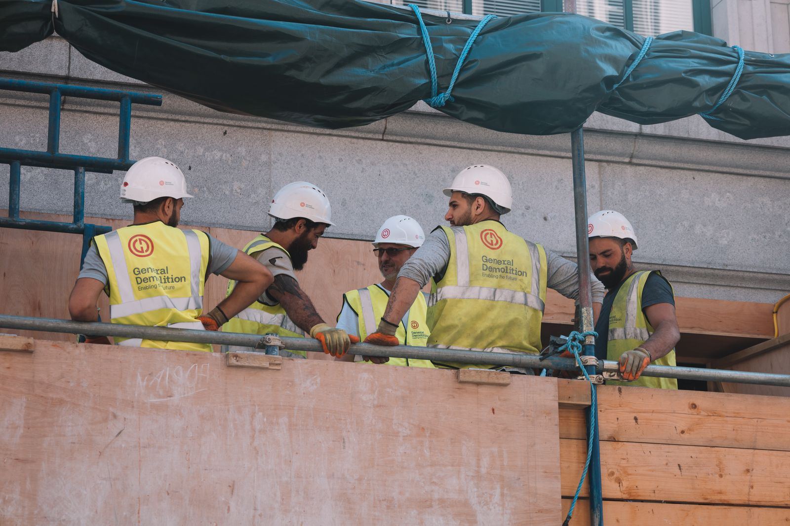 Construction crew in safety gear working on site