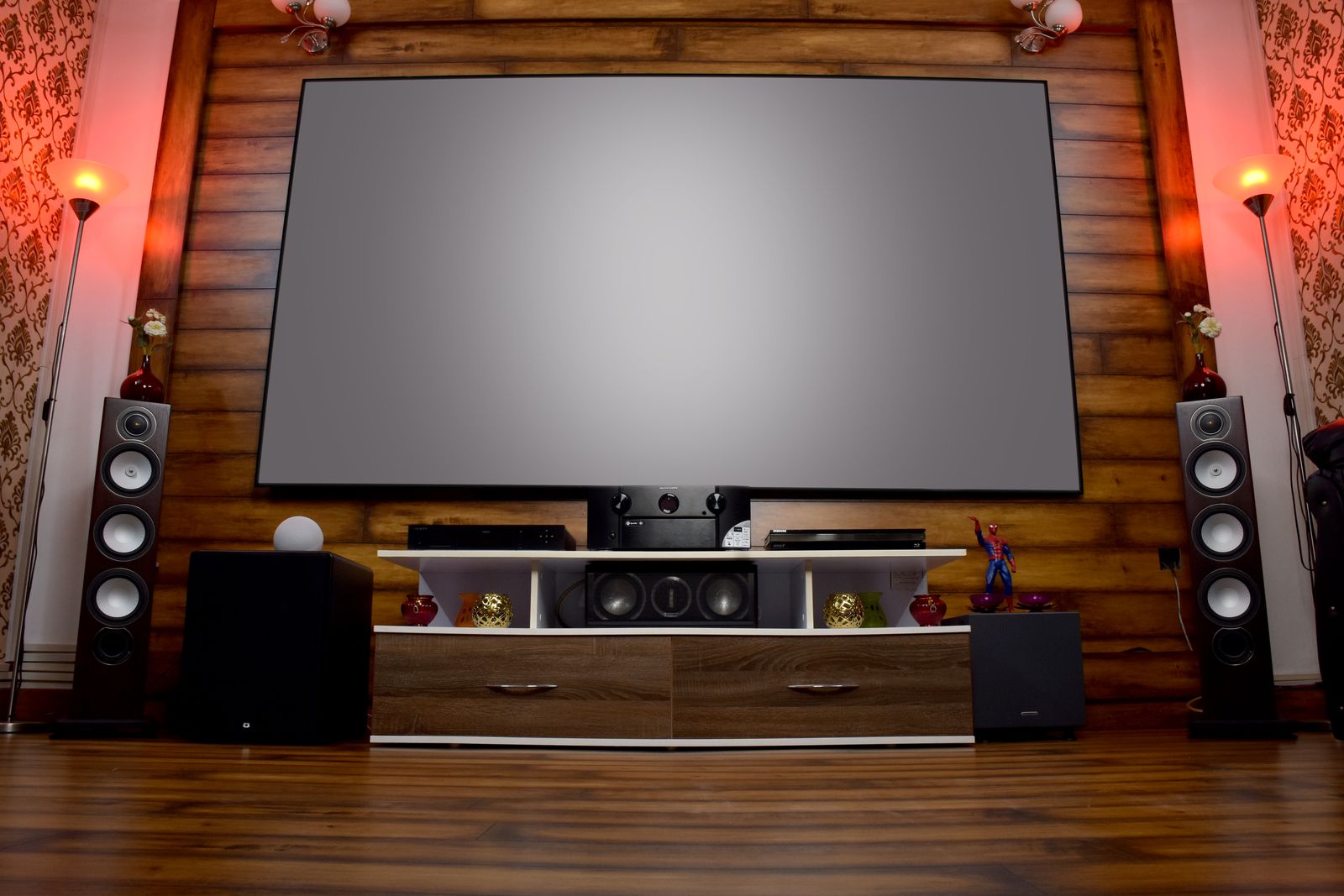 Home theater room with a large screen and speakers