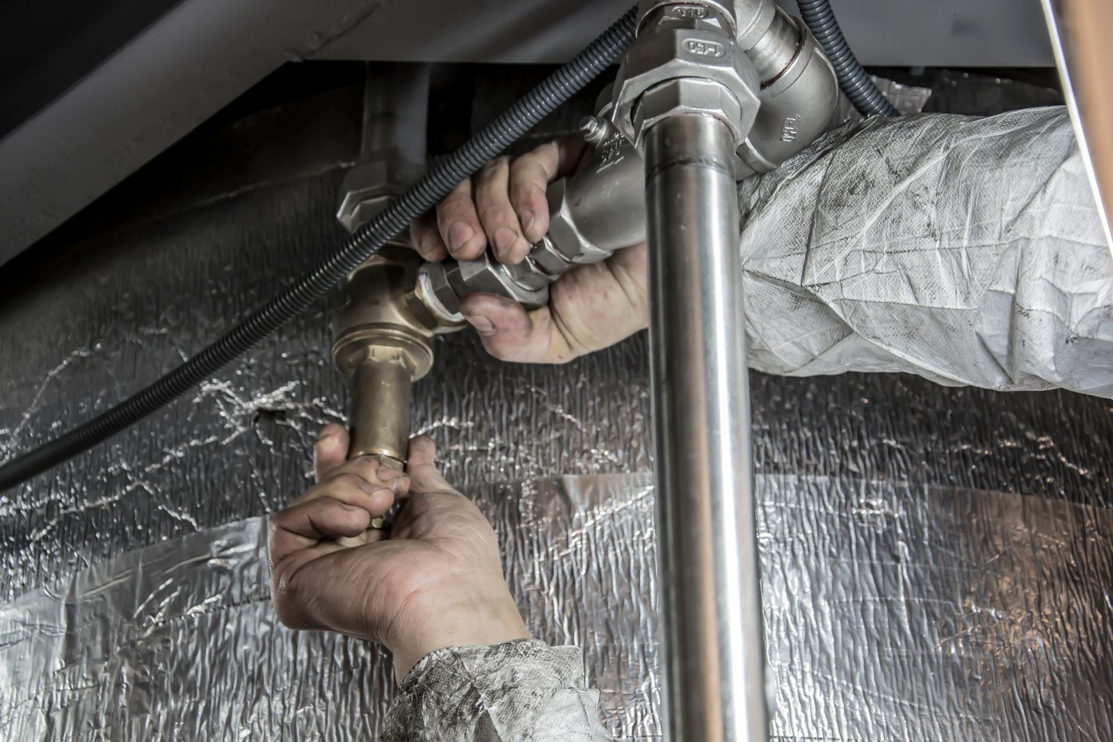 Plumber fitting steel supply pipes