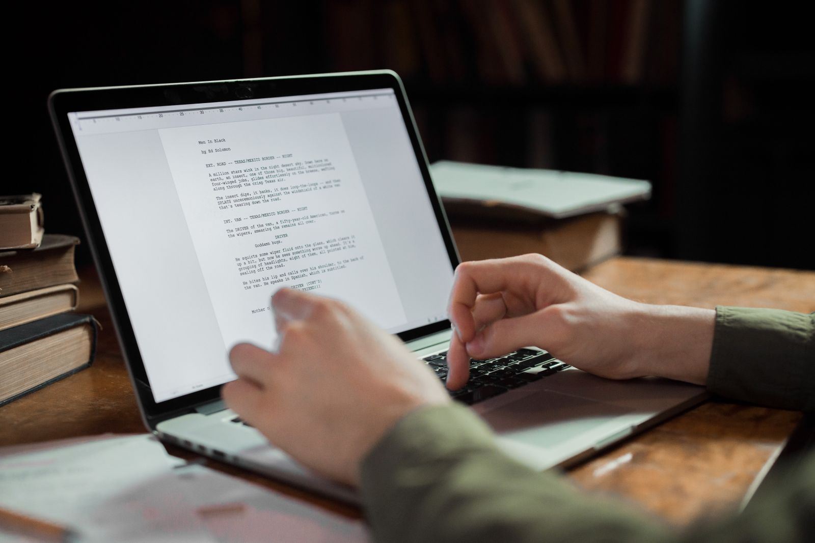Writer working on a laptop at a desk