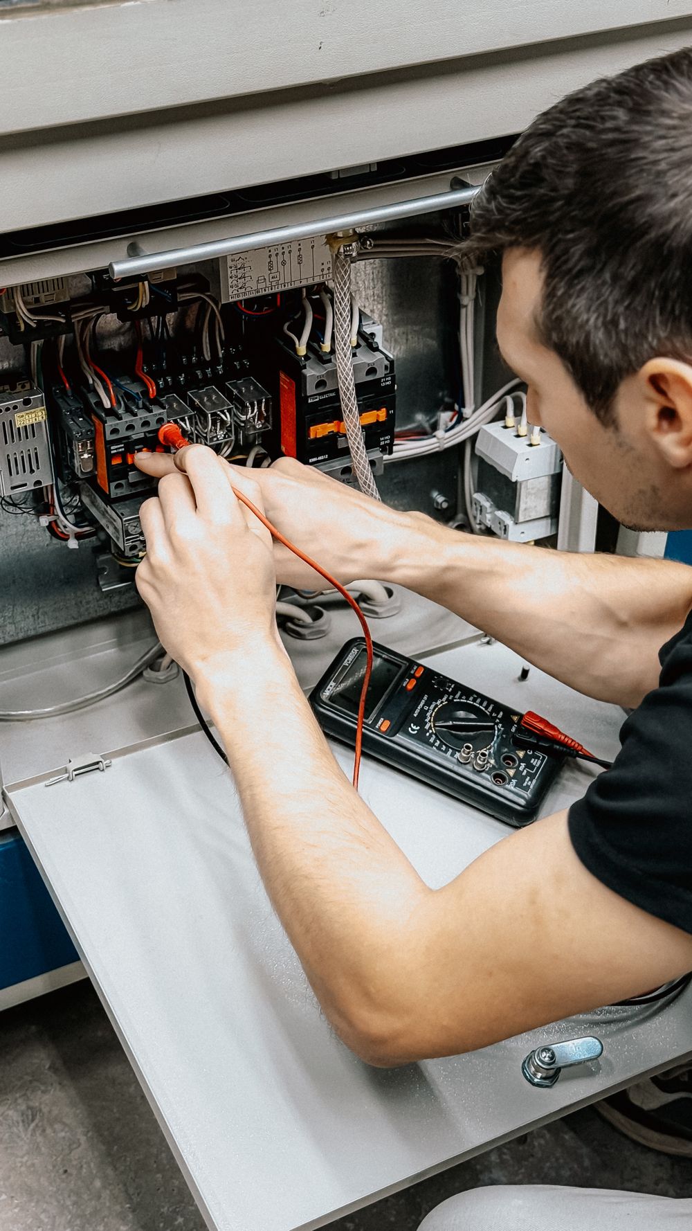 Contractor working on an electrical panel